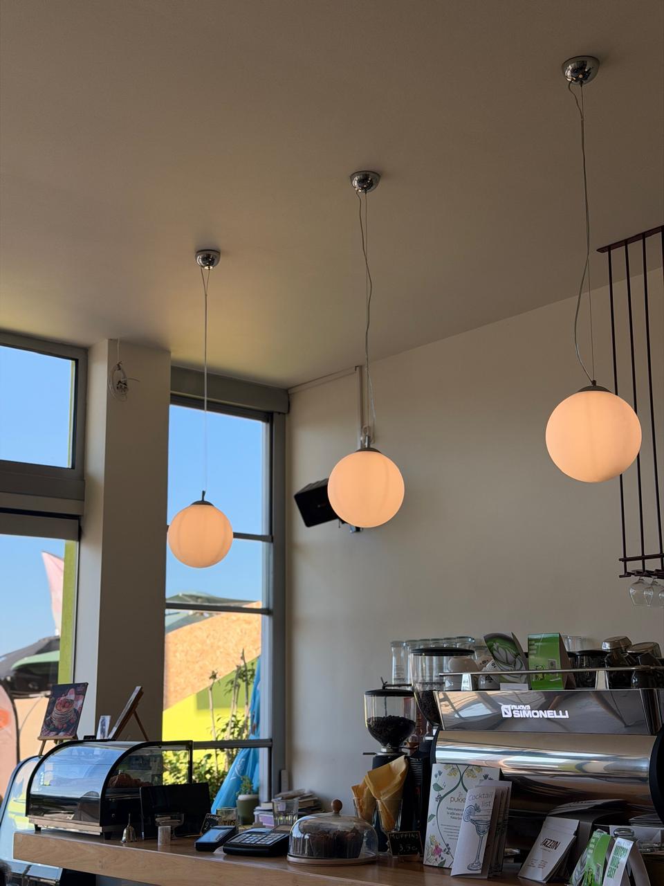 Globe pendant lights above the espresso counter at Jazzin